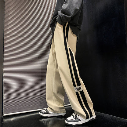 Jogginghose Herren in weiter Form mit Streifen - khaki